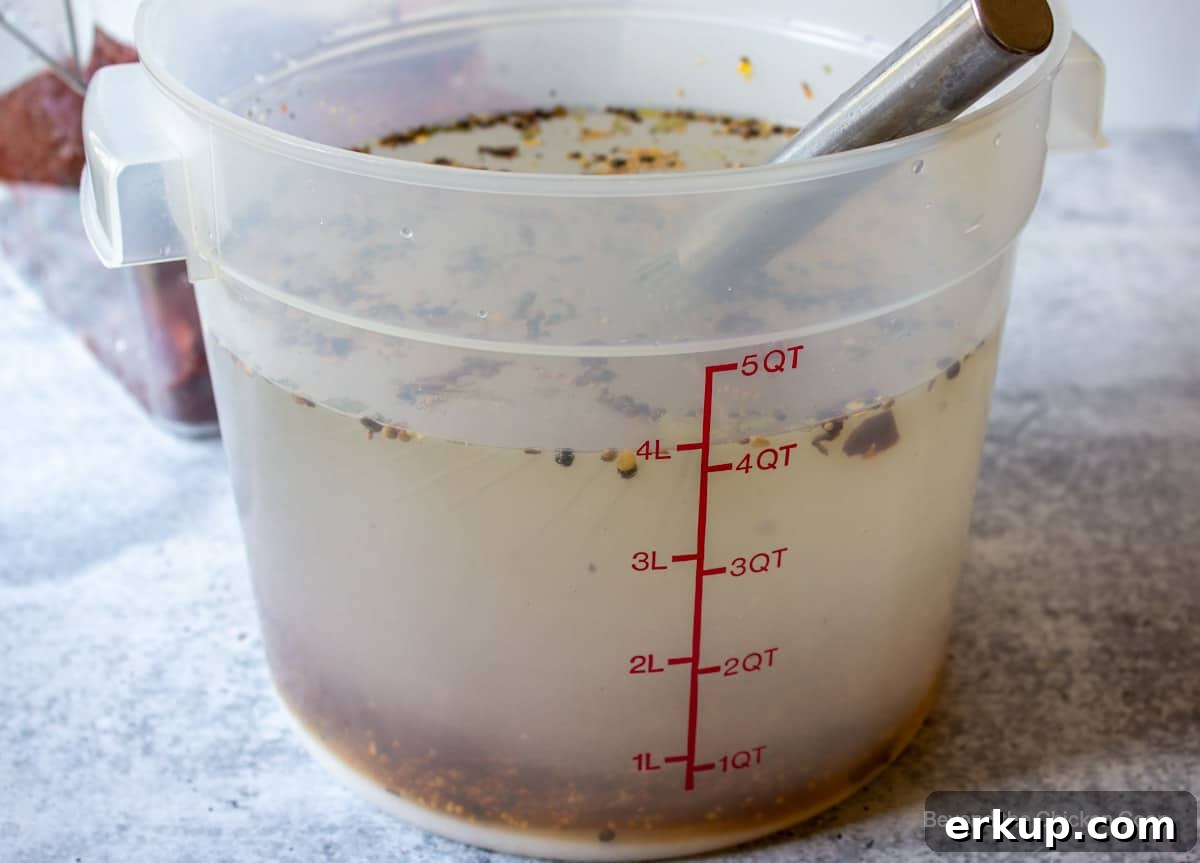 A large plastic tub filled with water and seasonings.