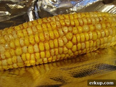 Roasted Corn with Chipotle and Cinnamon 3 Corn wrapped in foil ready to roast