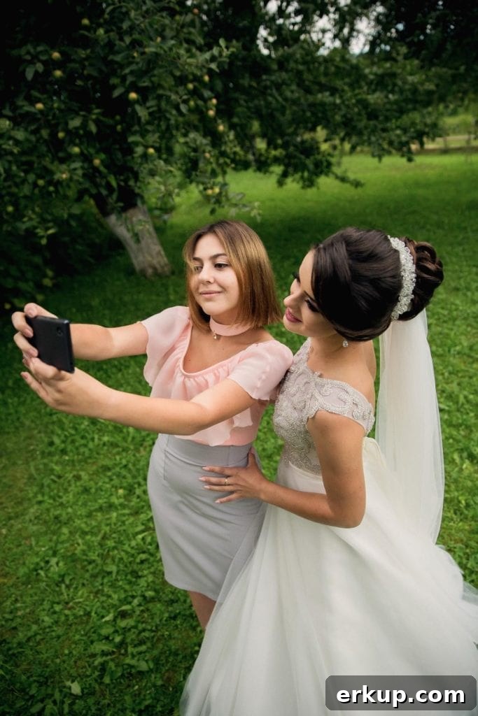 bridesmaid and bride taking a selfie