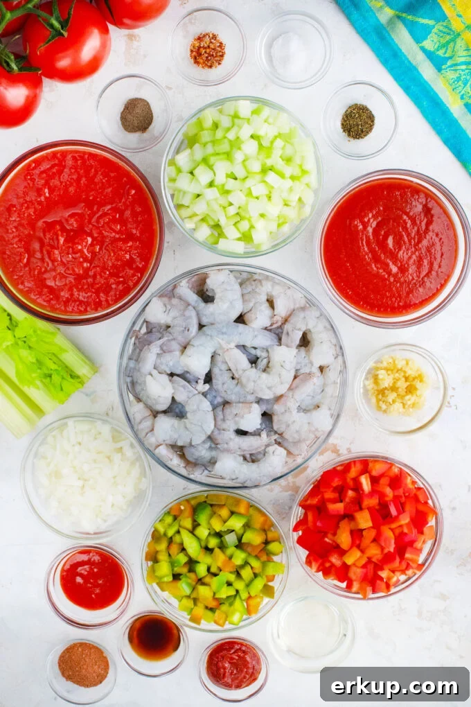 Overhead shot of shrimp creole ingredients in bowls.