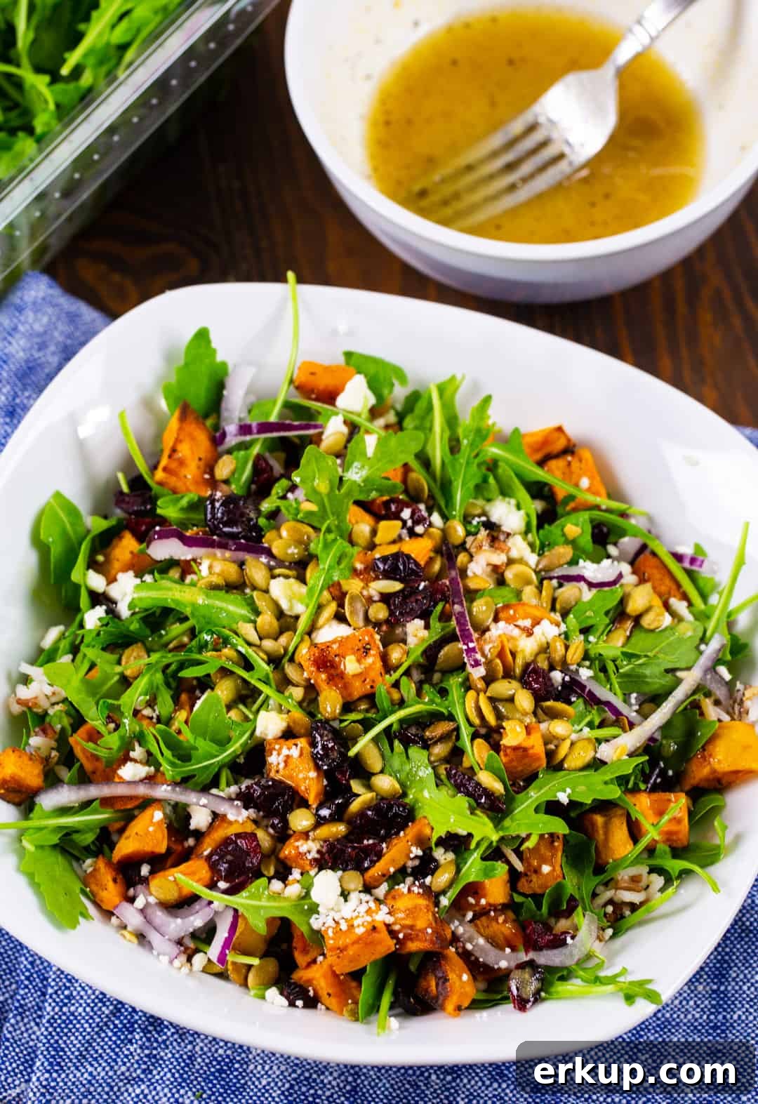 Roasted Sweet Potato, Arugula and Feta Salad Recipe 3 Sweet Potato Salad in a bowl and a bowl full of vinaigrette.