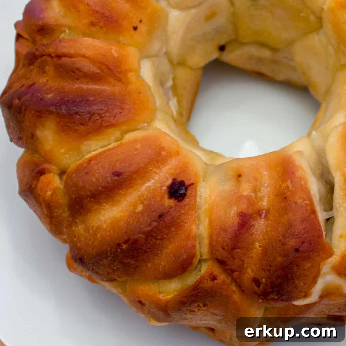 Seafood-Stuffed Monkey Bread: Savory Pull-Apart Bake 2 A close up picture of baked biscuits in a bundt pan.