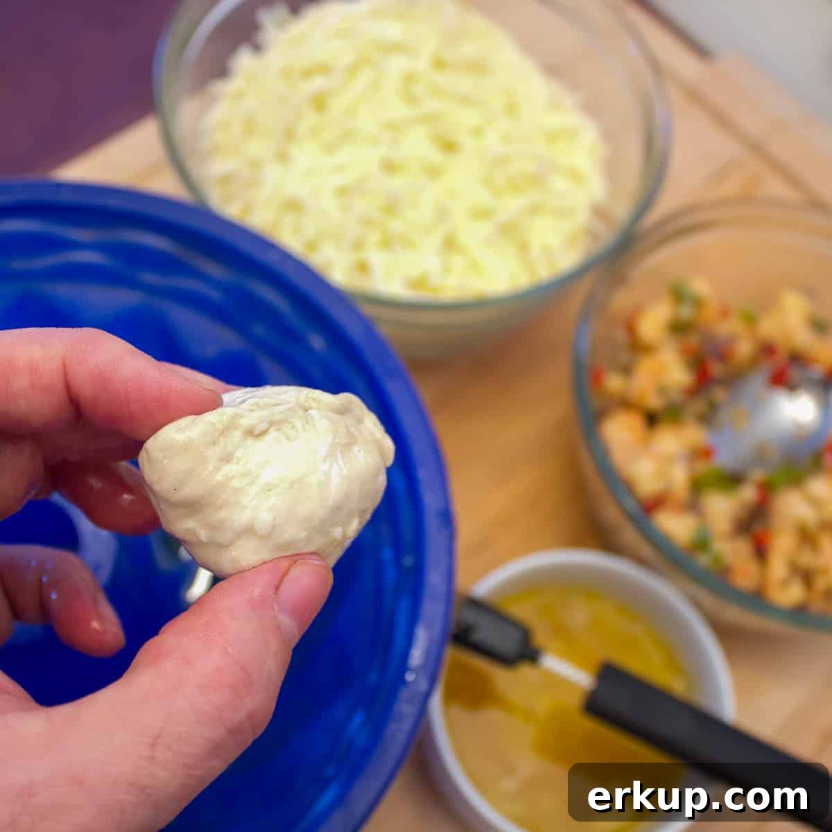 Seafood-Stuffed Monkey Bread: Savory Pull-Apart Bake 5 Fold the biscuit dough around the filling to seal.