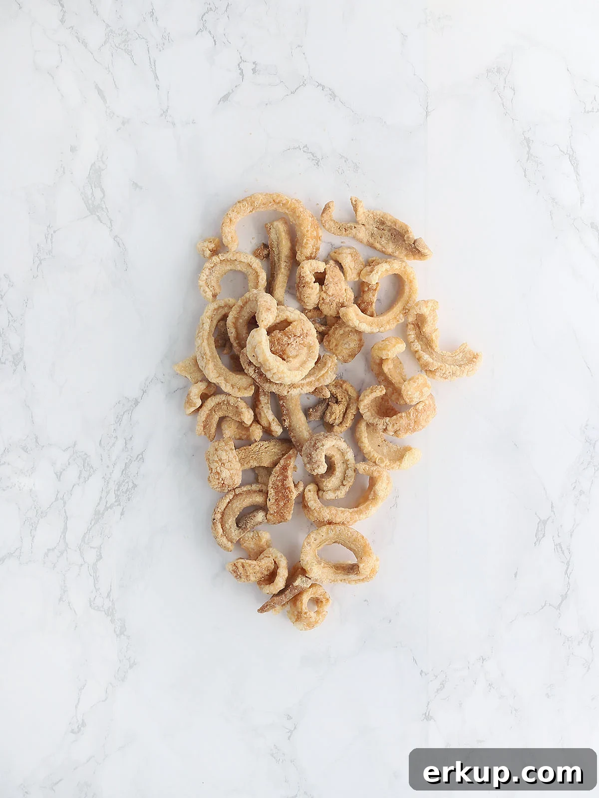 tender pork cracklins on a white background