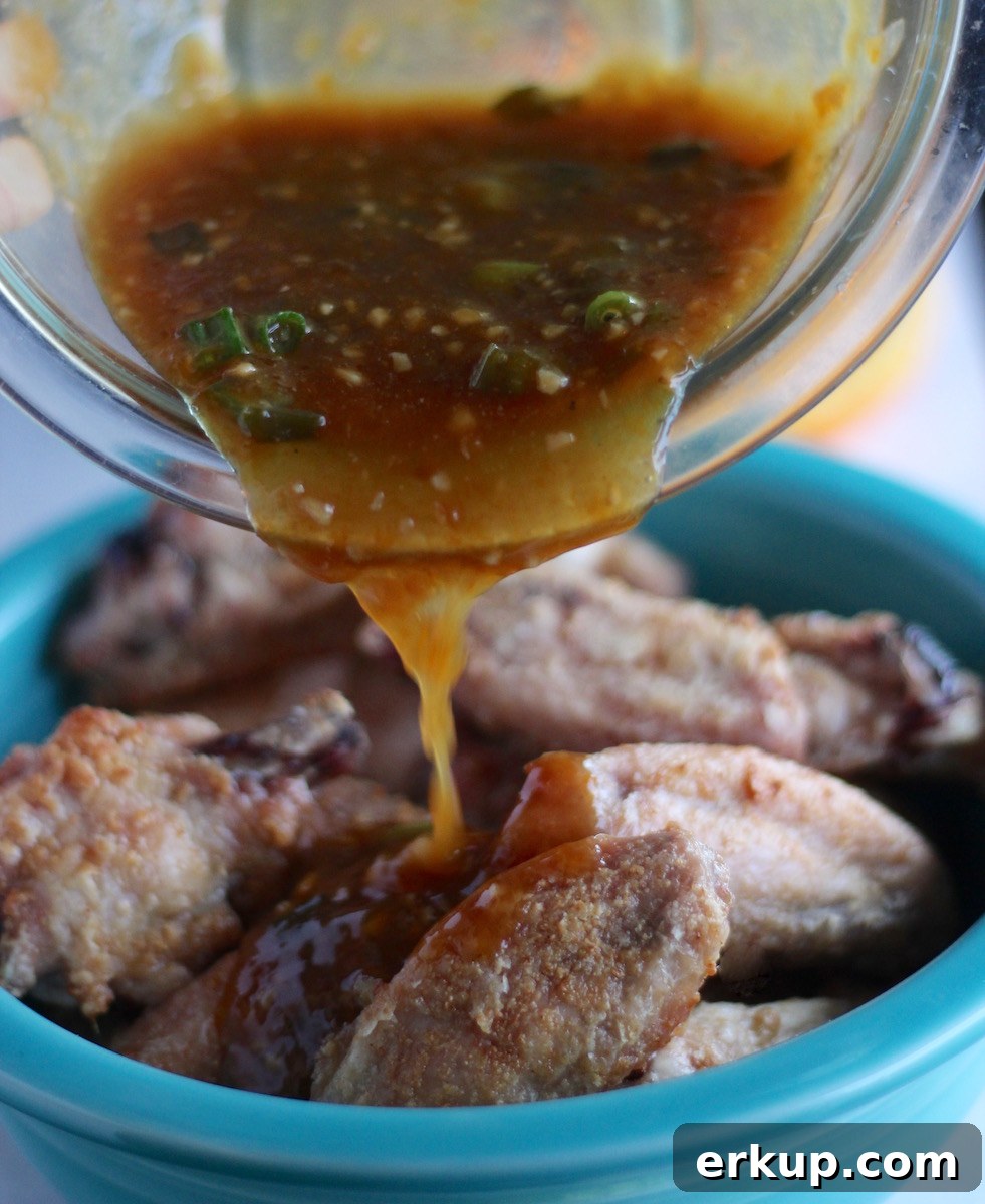 Sweet and Sticky Orange Ginger Wings (AIP) - these easy Paleo chicken wings are a crowd-pleaser with a sweet orange ginger garlic sauce! | fedandfulfilled.com