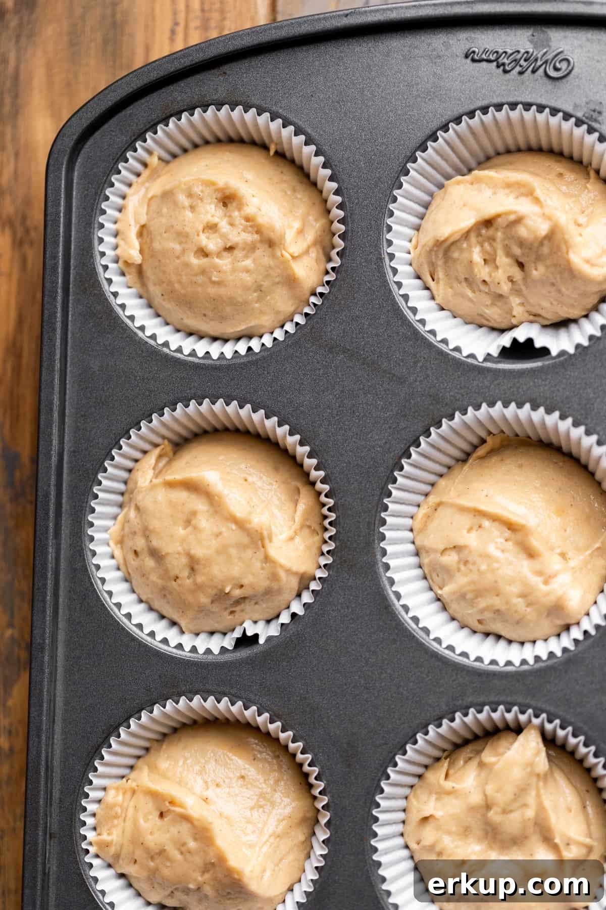 Maple Bacon Cupcakes with Candied Bacon 6 Maple batter in a cupcake pan.
