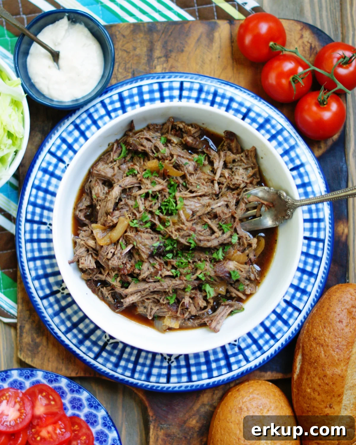 A bowl of shredded debris beef roast with debris gravy for New Orleans po boys.