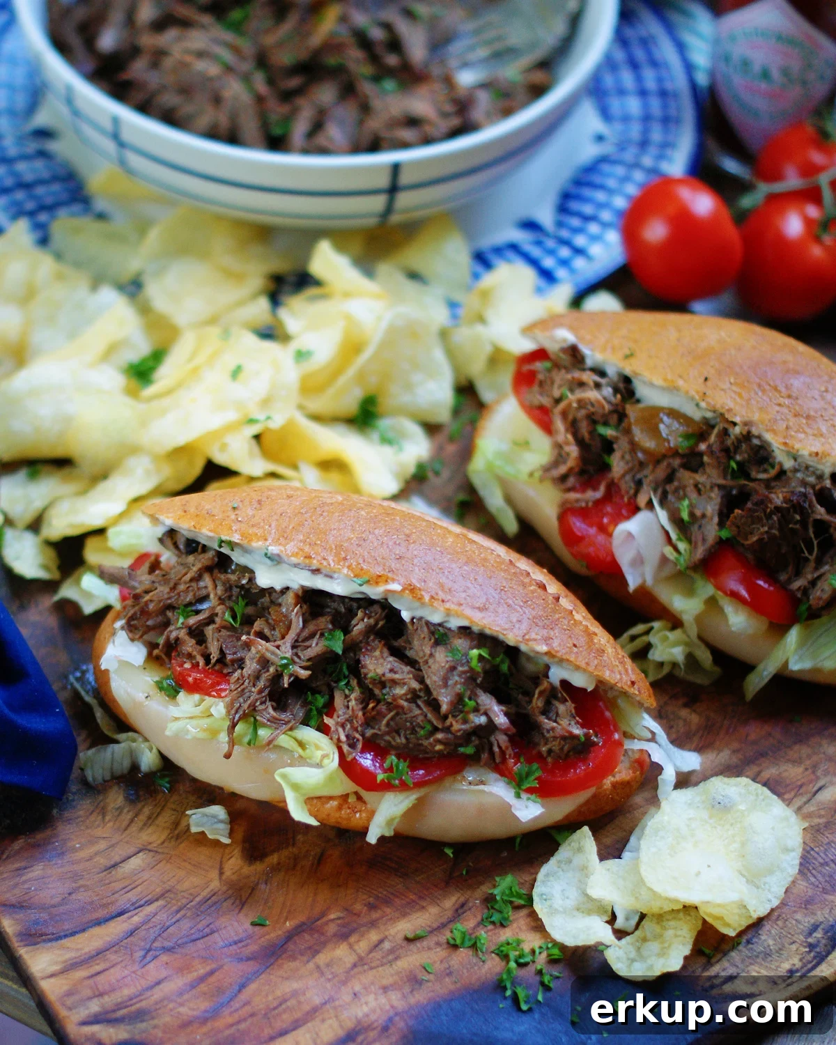 An authentic New Orleans roast beef debris po boy with lettuce, tomato and homemade shredded chuck roast.
