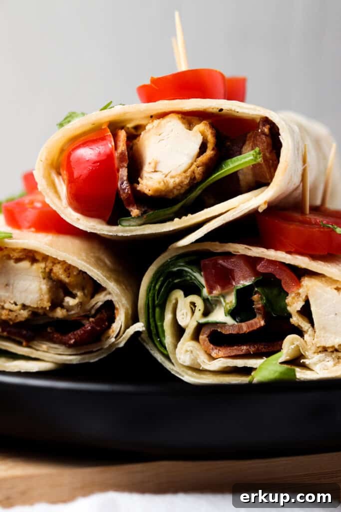 front shot of crispy ranch wraps on black plate