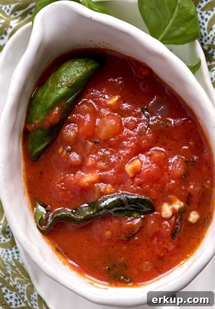 Tomato basil sauce in gravy boat.