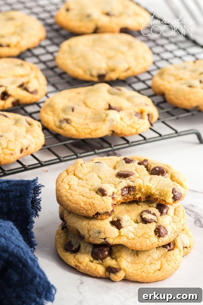 These Chocolate Chip Pudding Cookies are soft and chewy and always a hit. Easy to make with instant pudding, you can even freeze to make a few at a time! Chocolate Chip Pudding Cookies on a cooling rack