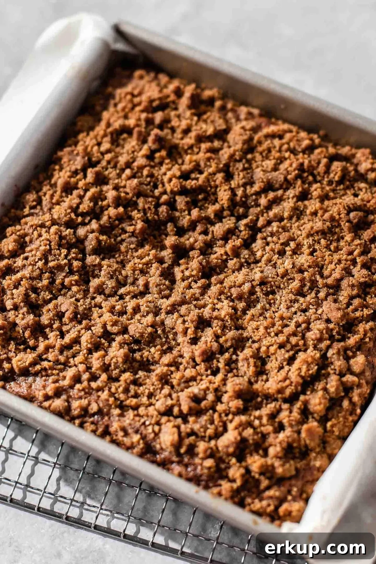 baked and slightly cooled sour cream zucchini coffee cake in baking pan