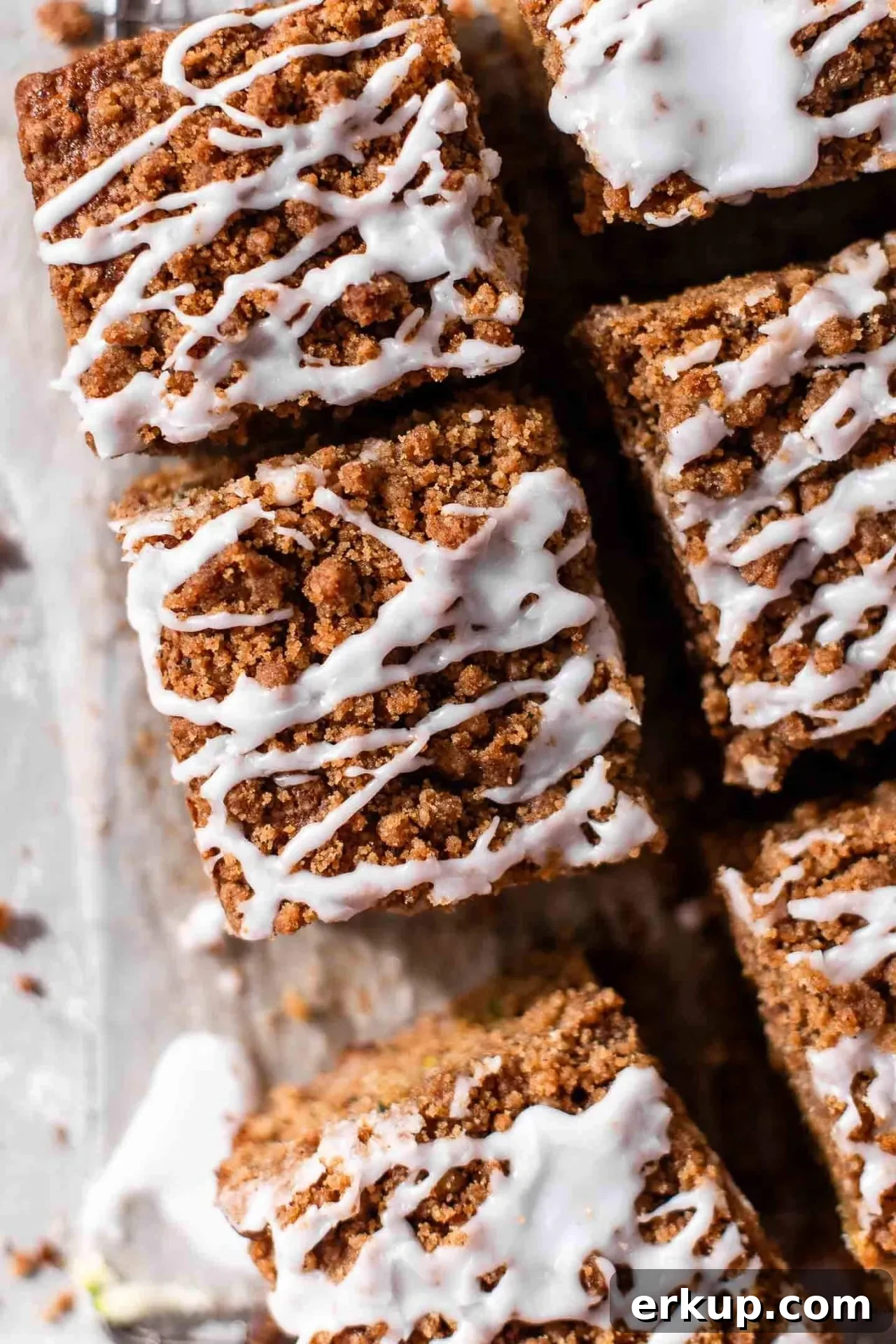 sliced sour cream zucchini coffee cake on parchment lined wire rack (5)