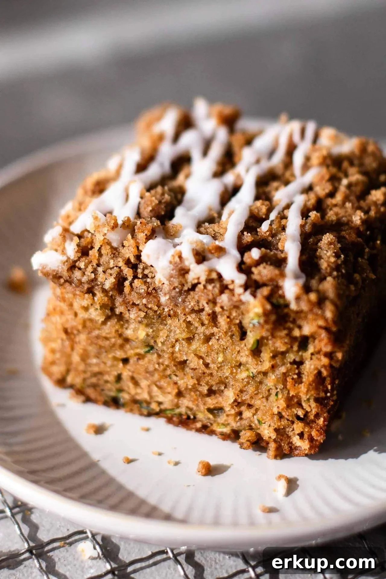 slice of sour cream zucchini coffee cake in plate