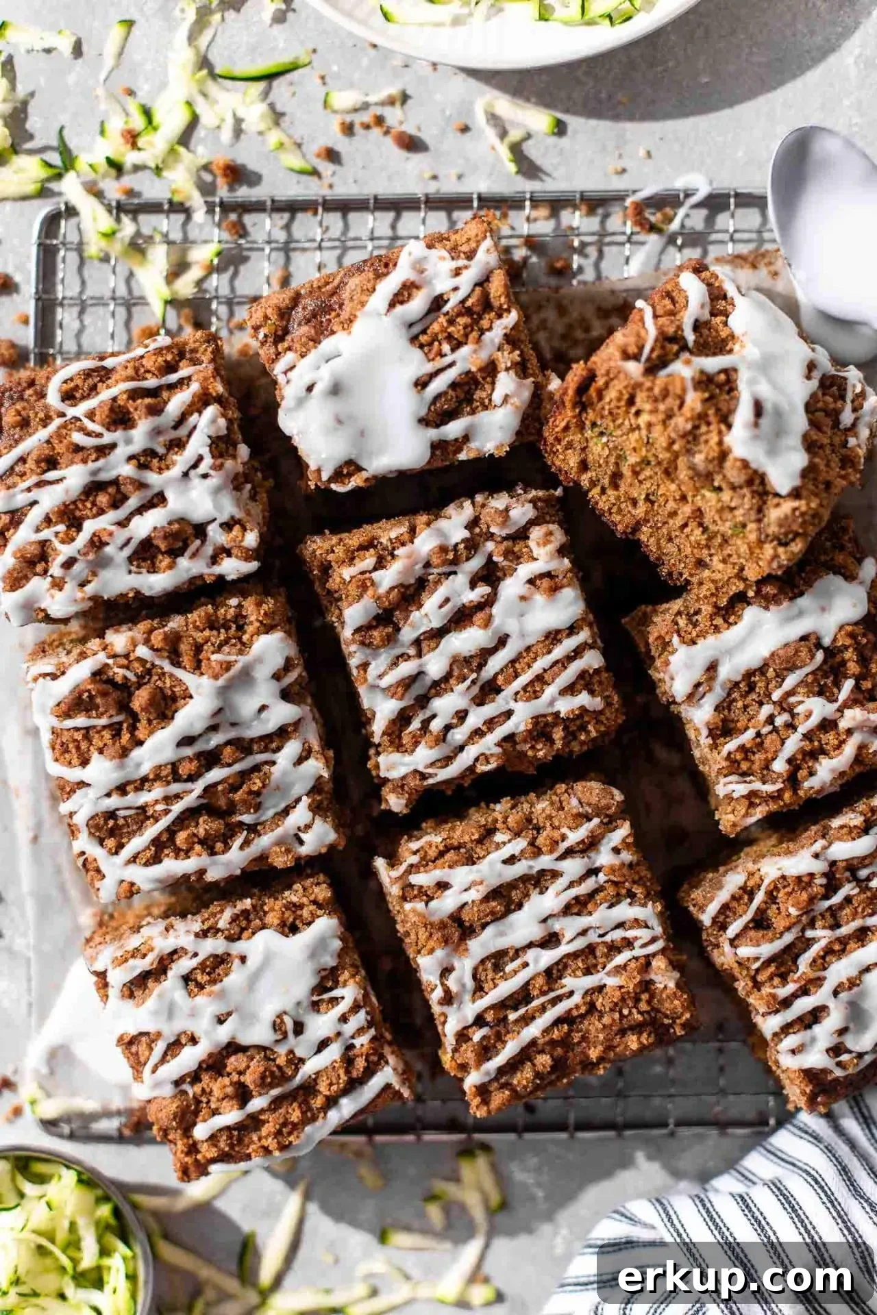 sliced sour cream zucchini coffee cake on parchment lined wire rack (3)