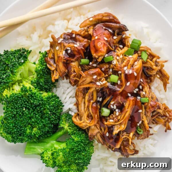 Crockpot teriyaki chicken on top of rice, with broccoli.