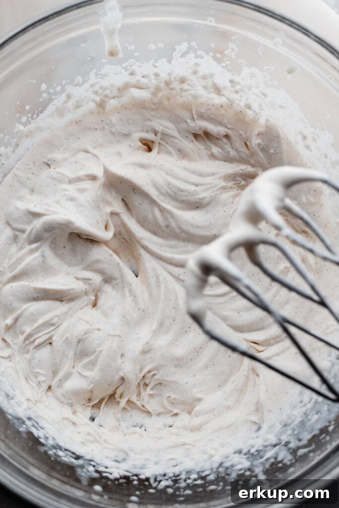 Whipped cream at soft peaks stage.