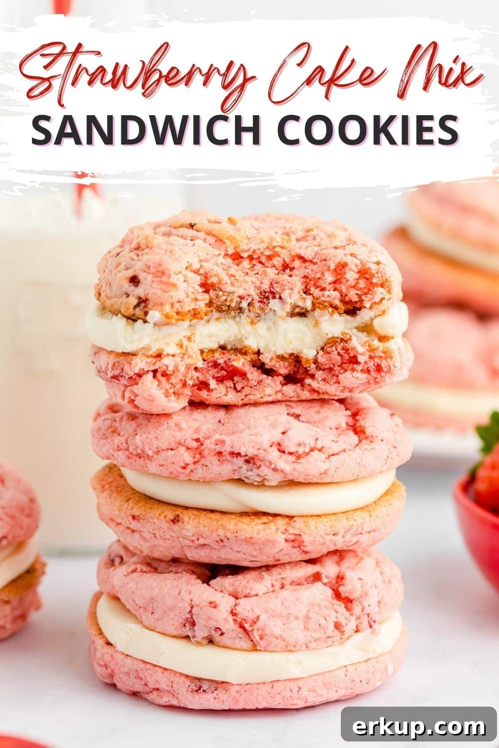 Homemade Strawberry Cake Mix Cookies 2 strawberry sandwich cookies stacked with bite shot and milk in background