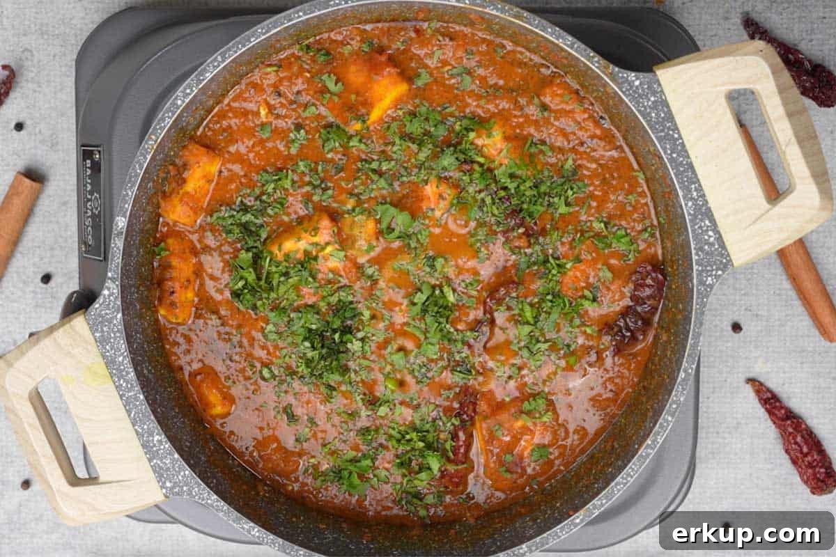 Lime juice and cilantro added to ready paneer masala.