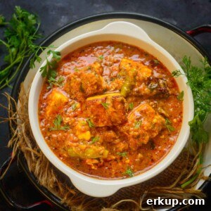 Paneer masala served in a bowl.
