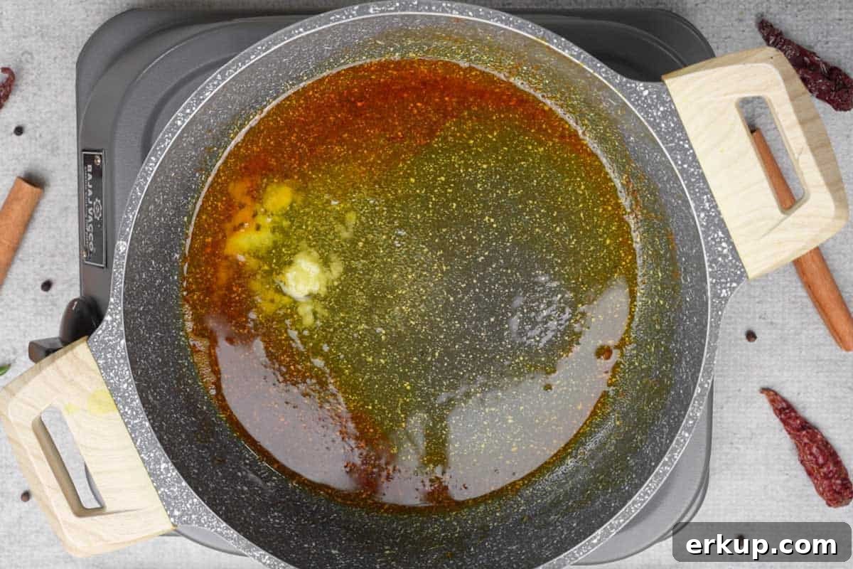 Oil and ghee heating in a pan.