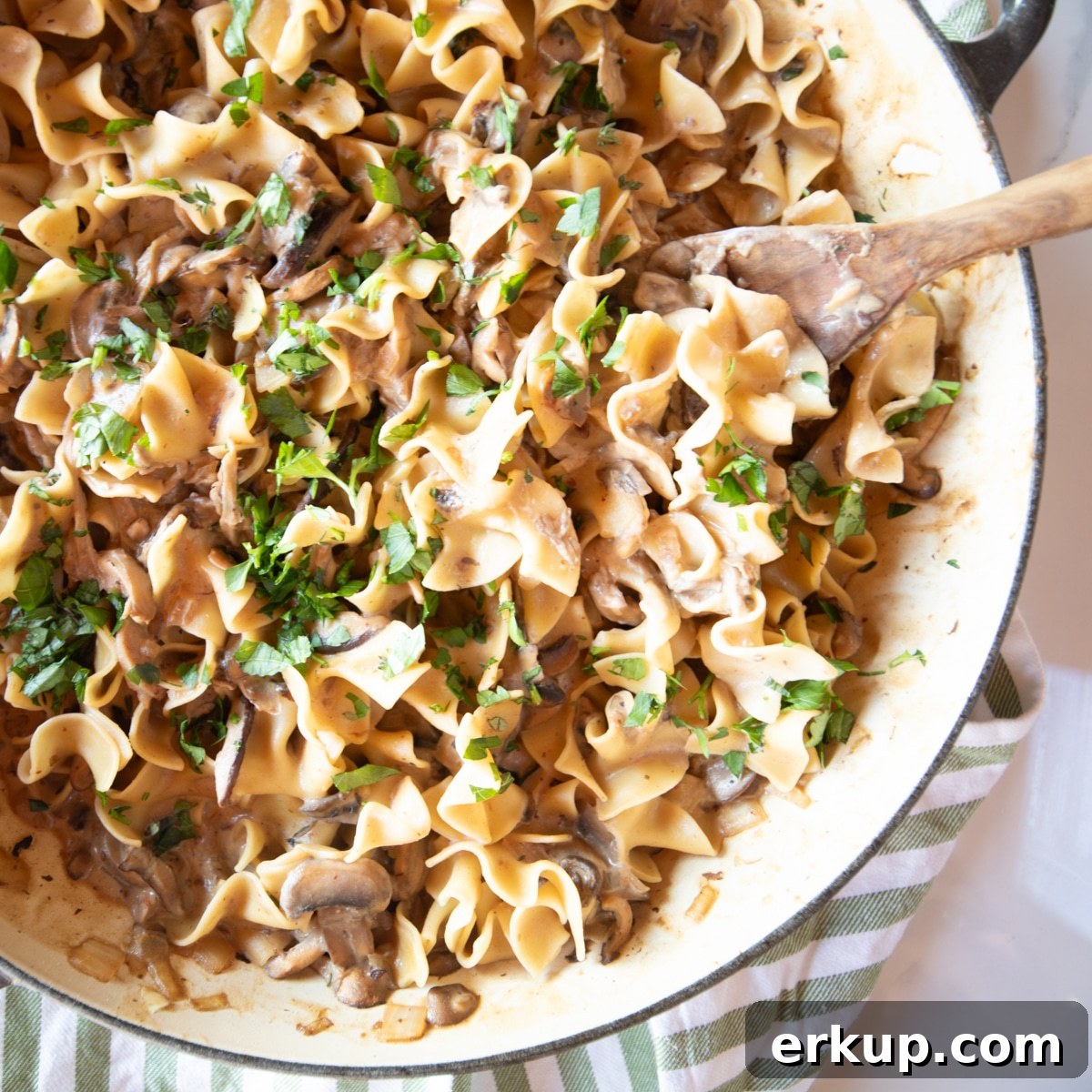 Week 5 Vegetarian Meal Plan for April 3 Close-up of creamy mushroom stroganoff in a pan, garnished with parsley