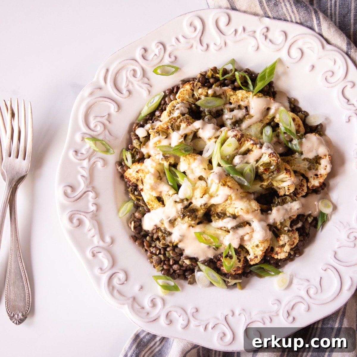 Week 5 Vegetarian Meal Plan for April 7 Cauliflower steaks over chimichurri lentils, topped with scallions and tahini sauce