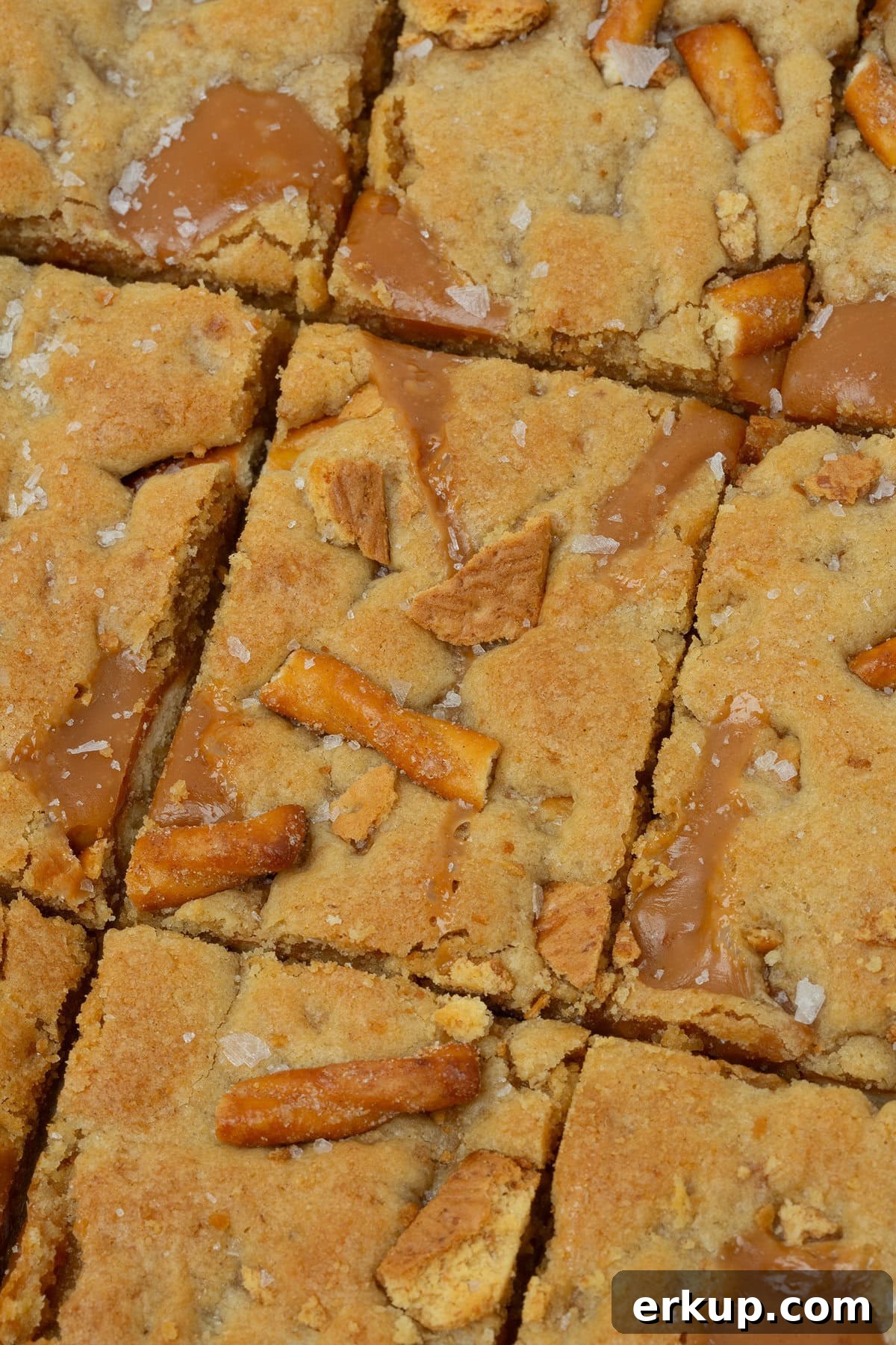caramel apple kitchen sink cookie bars cut into rectangles