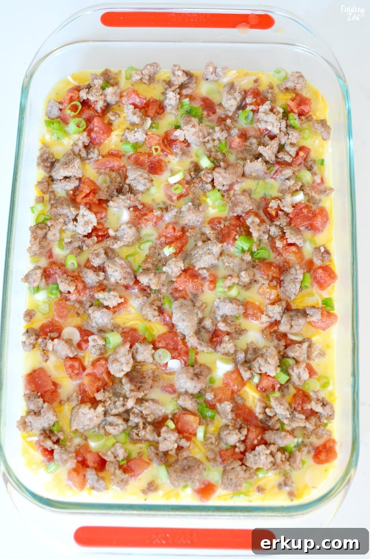 Sausage egg casserole in 13 x 9 inch dish ready to bake