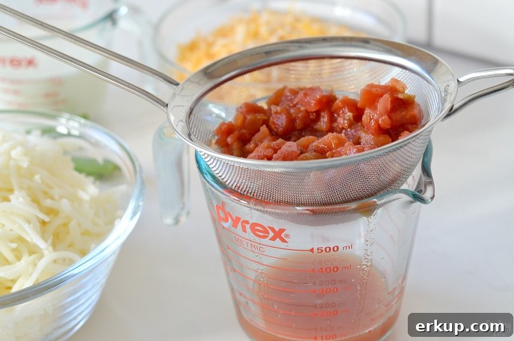 Draining can of Rotel for breakfast casserole