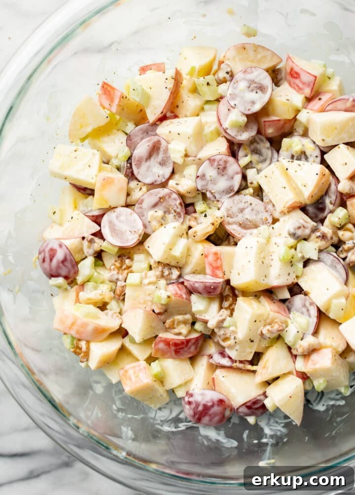 A glass bowl with Waldorf salad