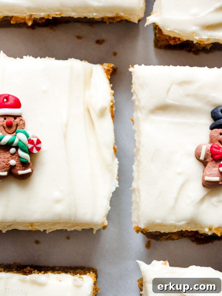 Close-up of gingerbread bars topped with cream cheese frosting.