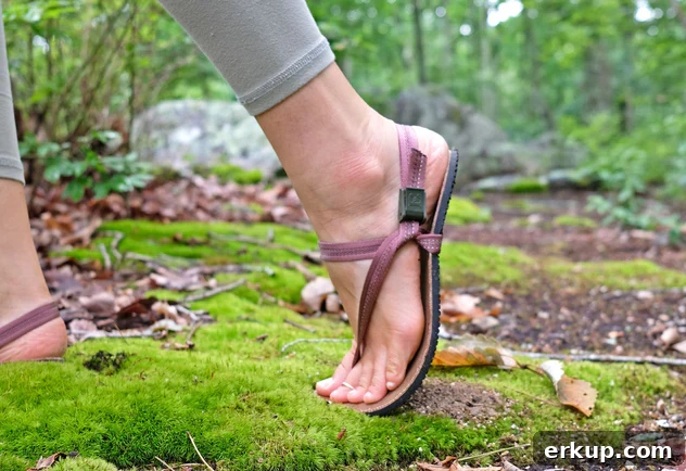 a picture of woman's feet wearing a non-toxic flip-flop from Earth Runners