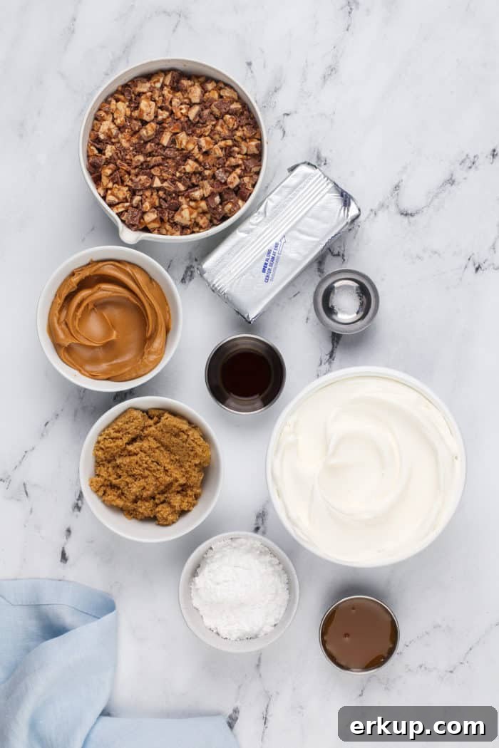 Ingredients for snickers dip arranged on a marble countertop.