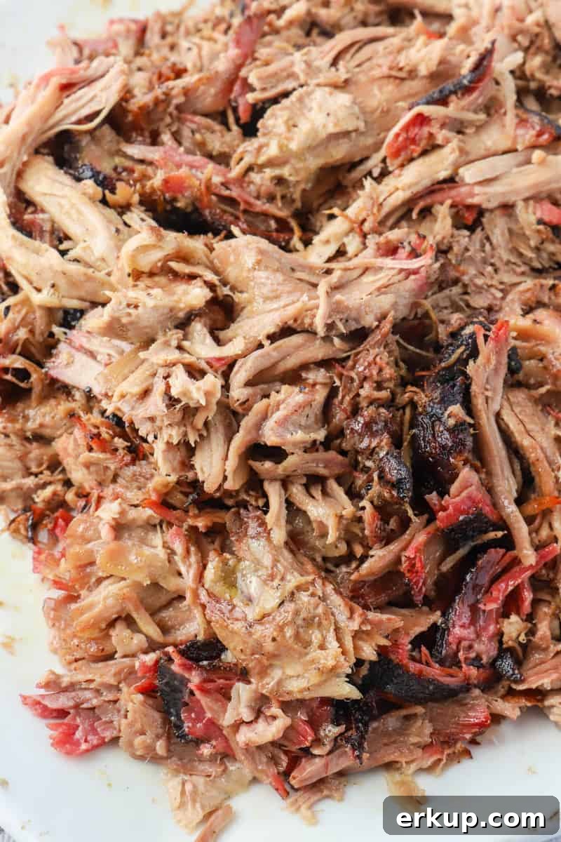 Smoked Pork Butt Recipe for Tender Pulled Pork 2 Smoked Pork Butt pulled on a platter