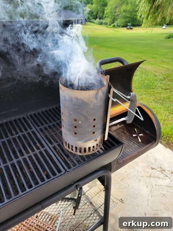 Smoked Pork Butt Recipe for Tender Pulled Pork 4 creating a charcoal base via a charcoal smoke chimney