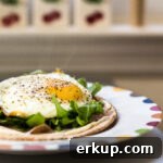 Crispy breakfast pita with fried egg and arugula