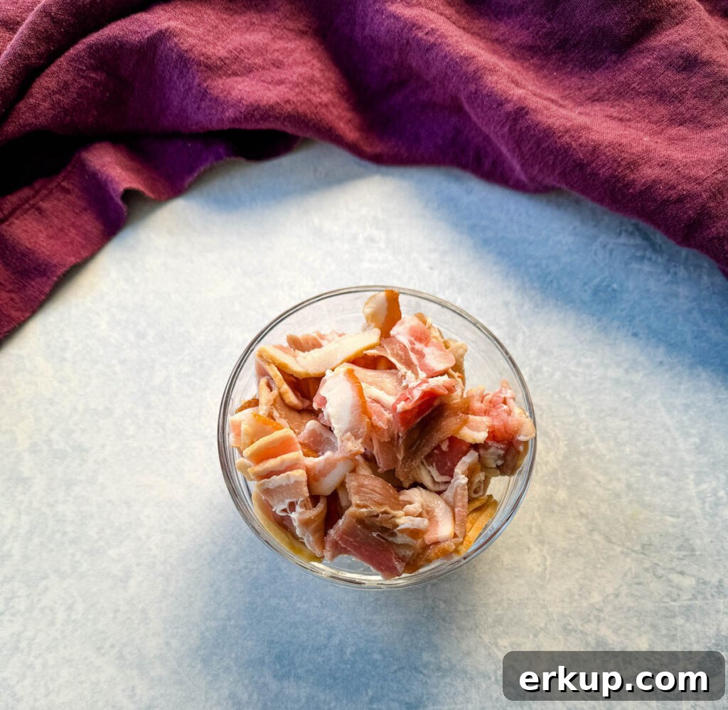 uncooked bacon in a glass bowl