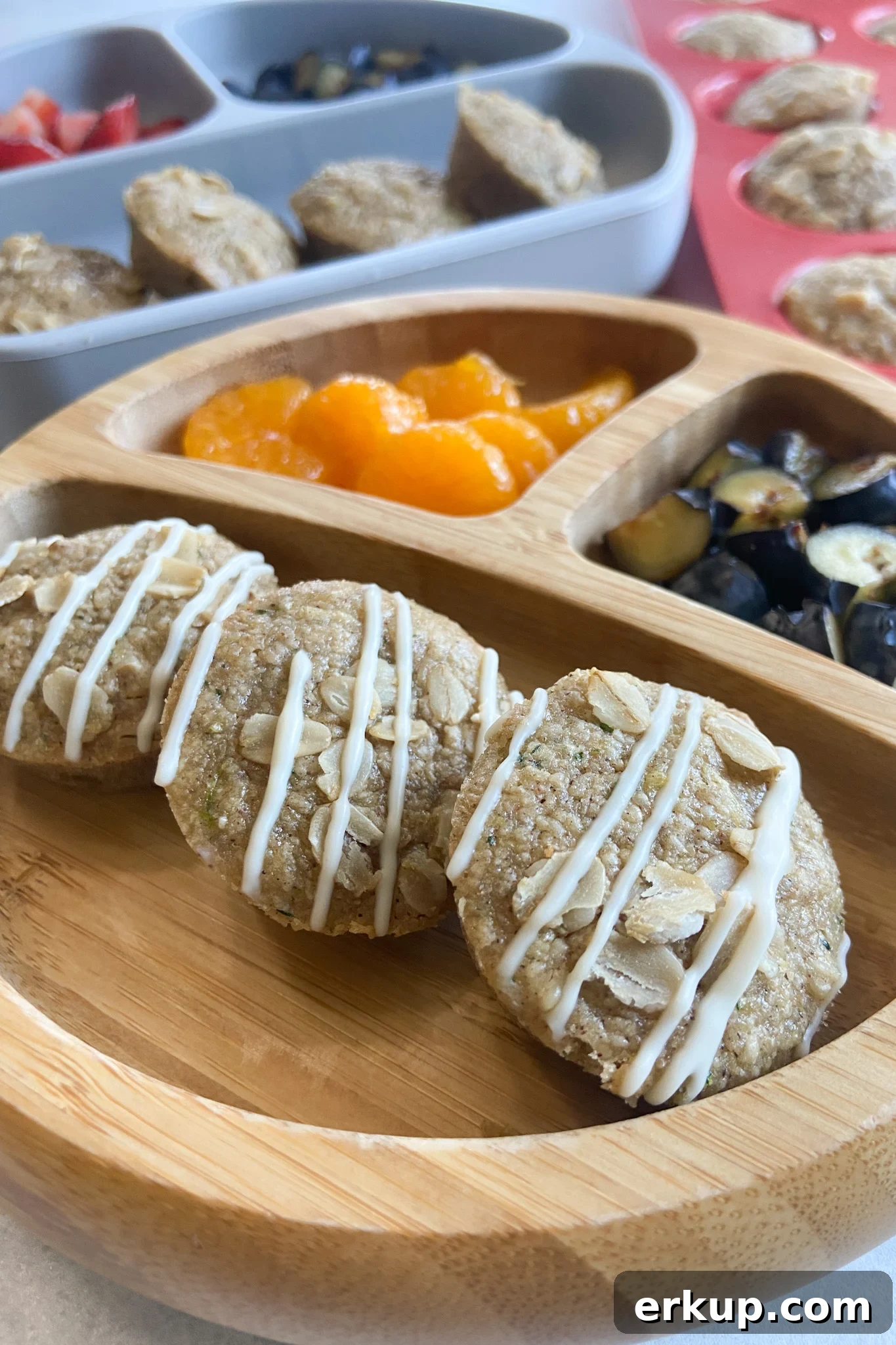 Zucchini muffins served with fruits.