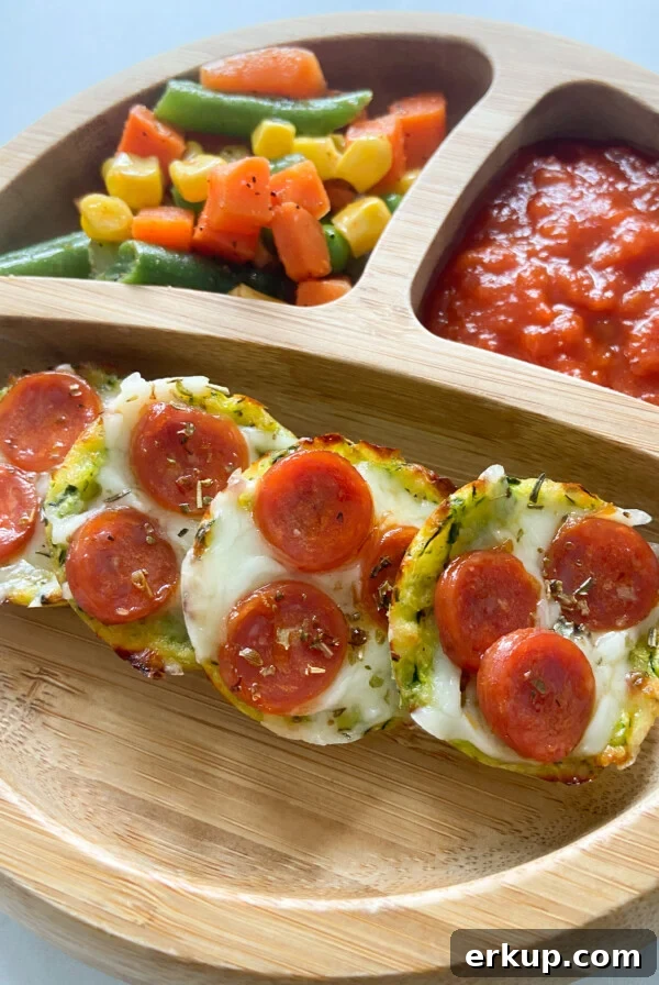 Mini zucchini pizza bites served with mixed veggies and marinara sauce
