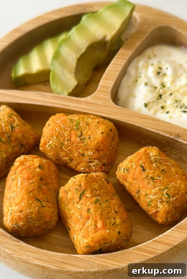 Sweet potato zucchini tots served with avocado and yogurt.
