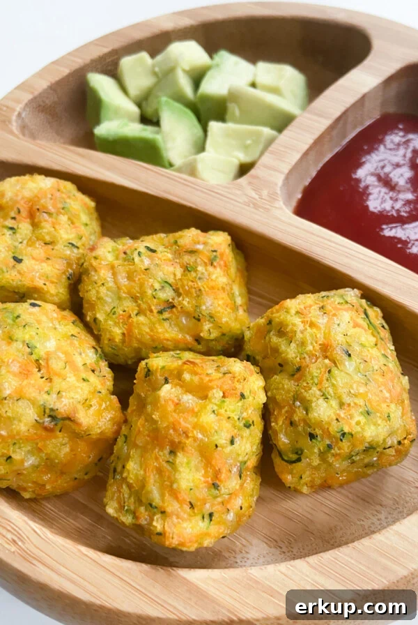 Zucchini carrot tots served with avocados and ketchup