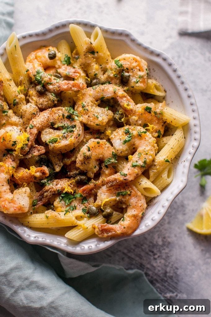 30-Minute Shrimp Piccata with Lemon Caper Sauce 2 close-up of easy shrimp piccata in a bowl with penne pasta