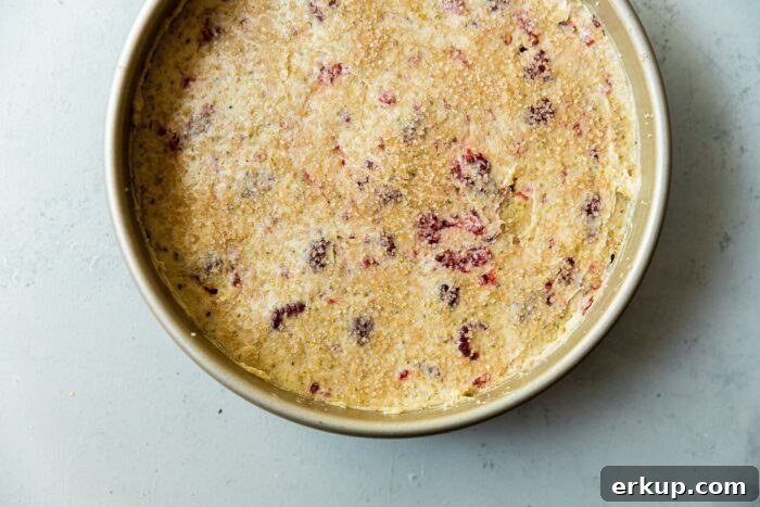 Raspberry Pistachio Cake Batter in Pan