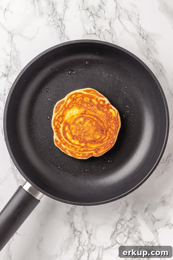Overhead view of pancake in skillet