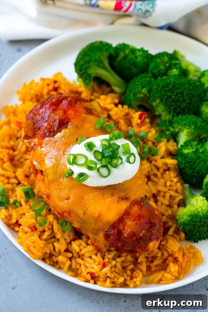 Salsa chicken served over Mexican rice with broccoli.