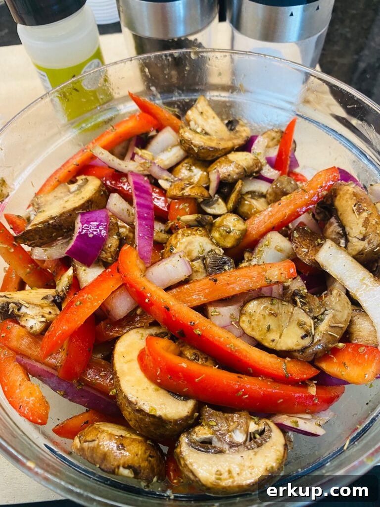 Air Fryer Quinoa Bowls with Roasted Vegetables 5 seasoned veggies in a bowl before cooking