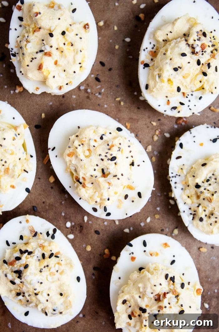 Keto Deviled Eggs with Everything Bagel Seasoning Recipe 10 aerial view of keto deviled eggs cut in half and sprinkled with everything bagel seasoning