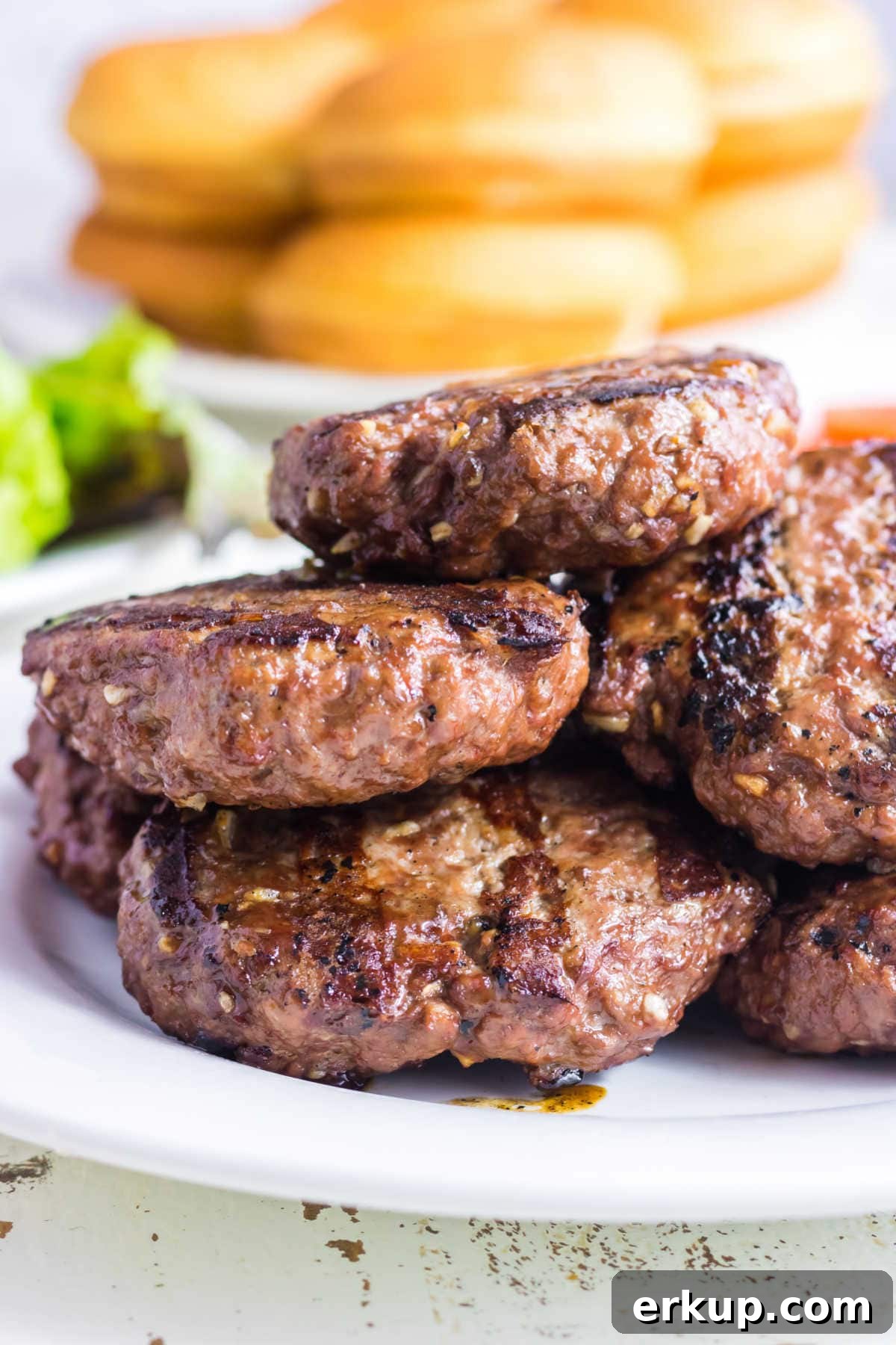 Closeup of grilled burgers ready to be eaten.