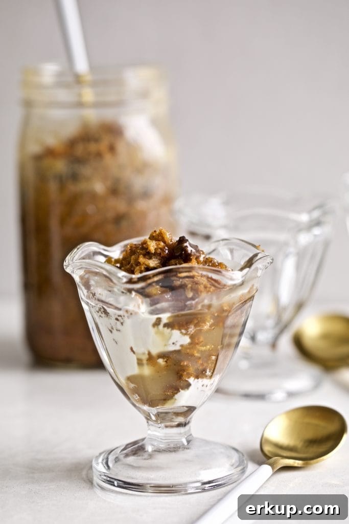 Small glass of steamed carrot pudding with caramel sauce.